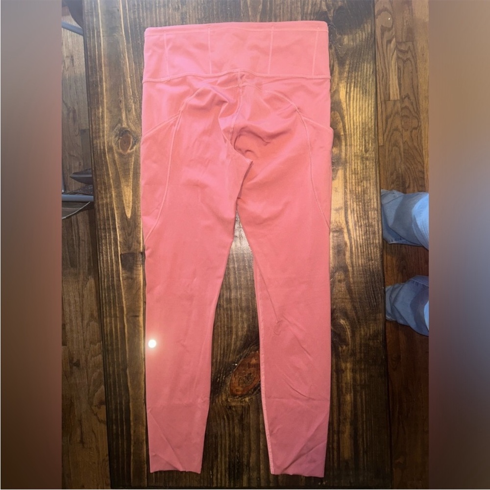 Lululemon size 8 leggings.
Dark pink color